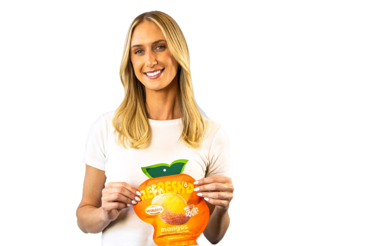Someone holding a pouch of REFRESH'D sour freeze-dried mangos.