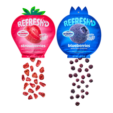 Berry Blend two-pack: a pouch of sour freeze-dried strawberries and a pouch of sour freeze-dried blueberries, pieces spilling out