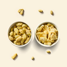 Super Sour Blend two-pack: a bowl of freeze-dried grape pieces and a bowl of freeze-dried pineapple pieces on cream, with a few loose pieces scattered around them