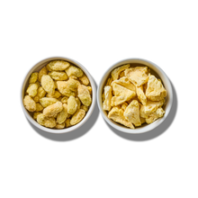 Super Sour Blend two-pack: a white bowl of freeze-dried grapes beside a white bowl of freeze-dried pineapple pieces, seen from above on white