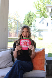 Model on a patio sofa, sour freeze-dried strawberries