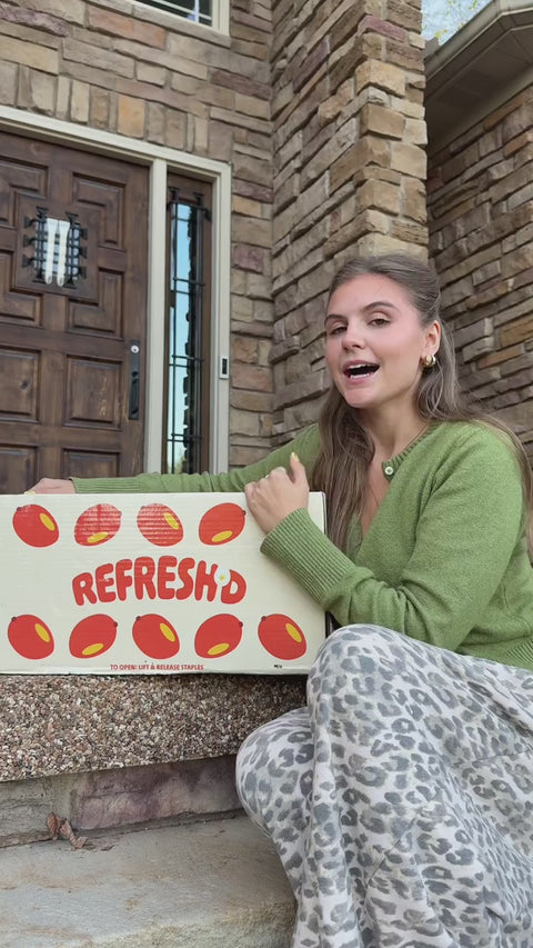 Front-porch unboxing: opens the strawberry shipping box and crate, pulls out and talks through pouches, reads